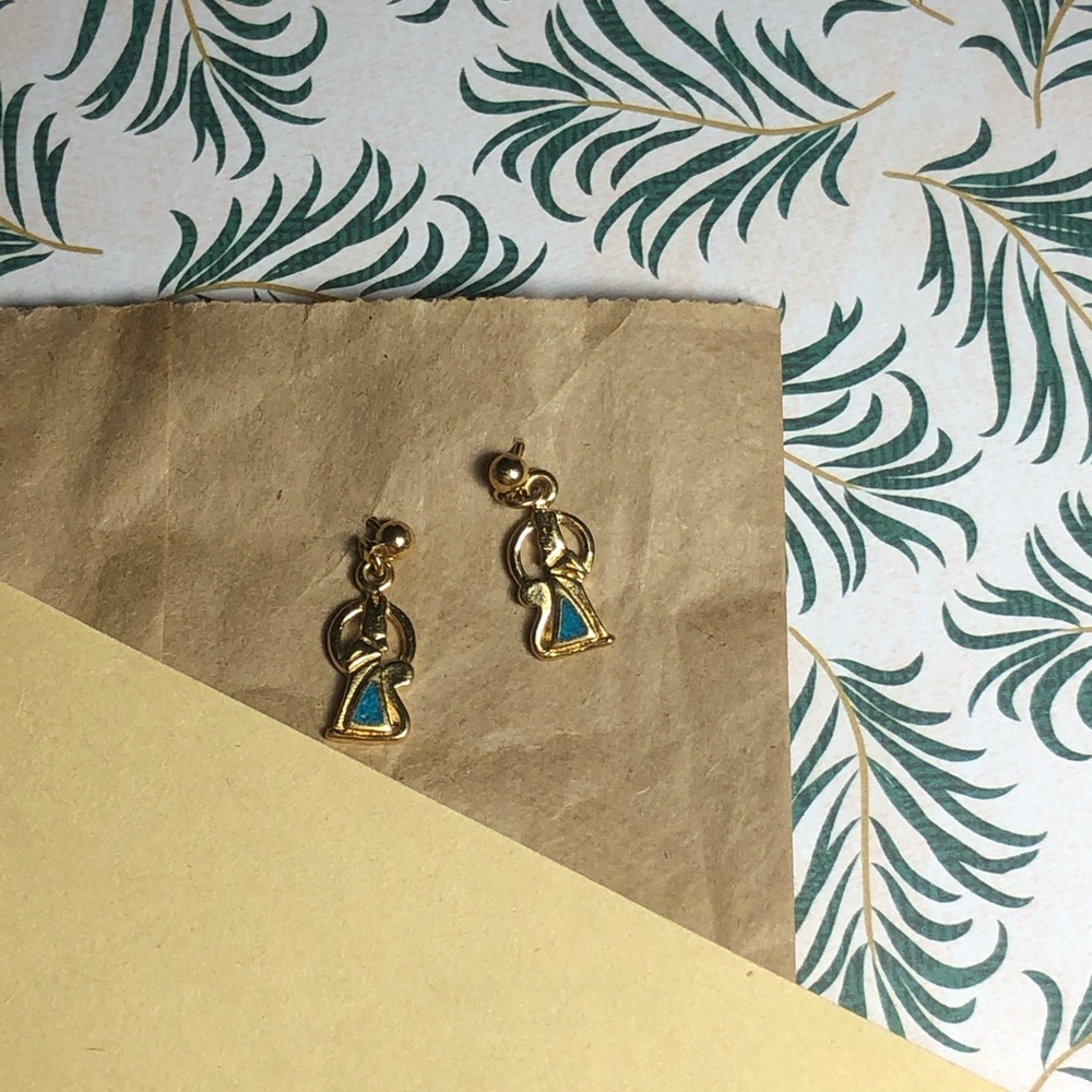 Gold coyote earring